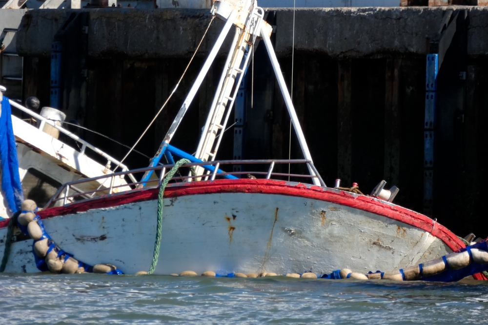 Boat partially submerged after accident