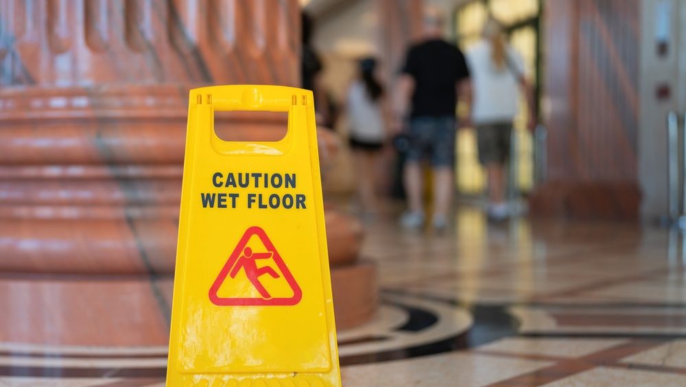 Wet floor sign displayed in an atrium of a public building