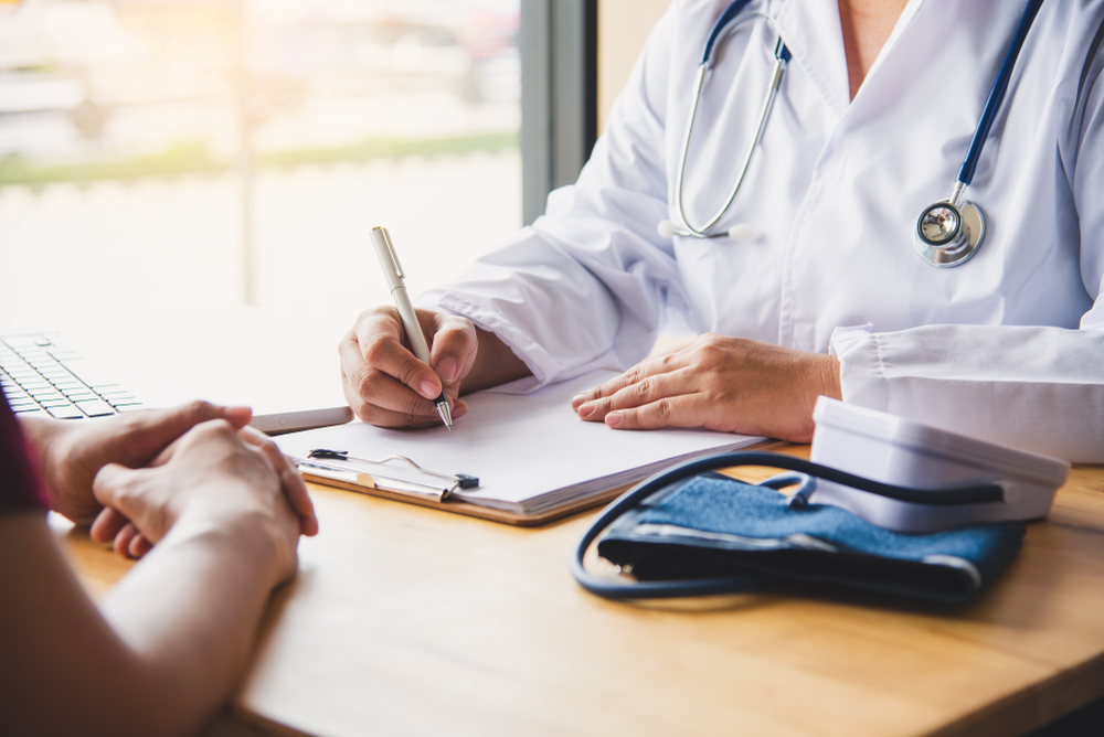 Doctor speaking to patient about injury and treatment options
